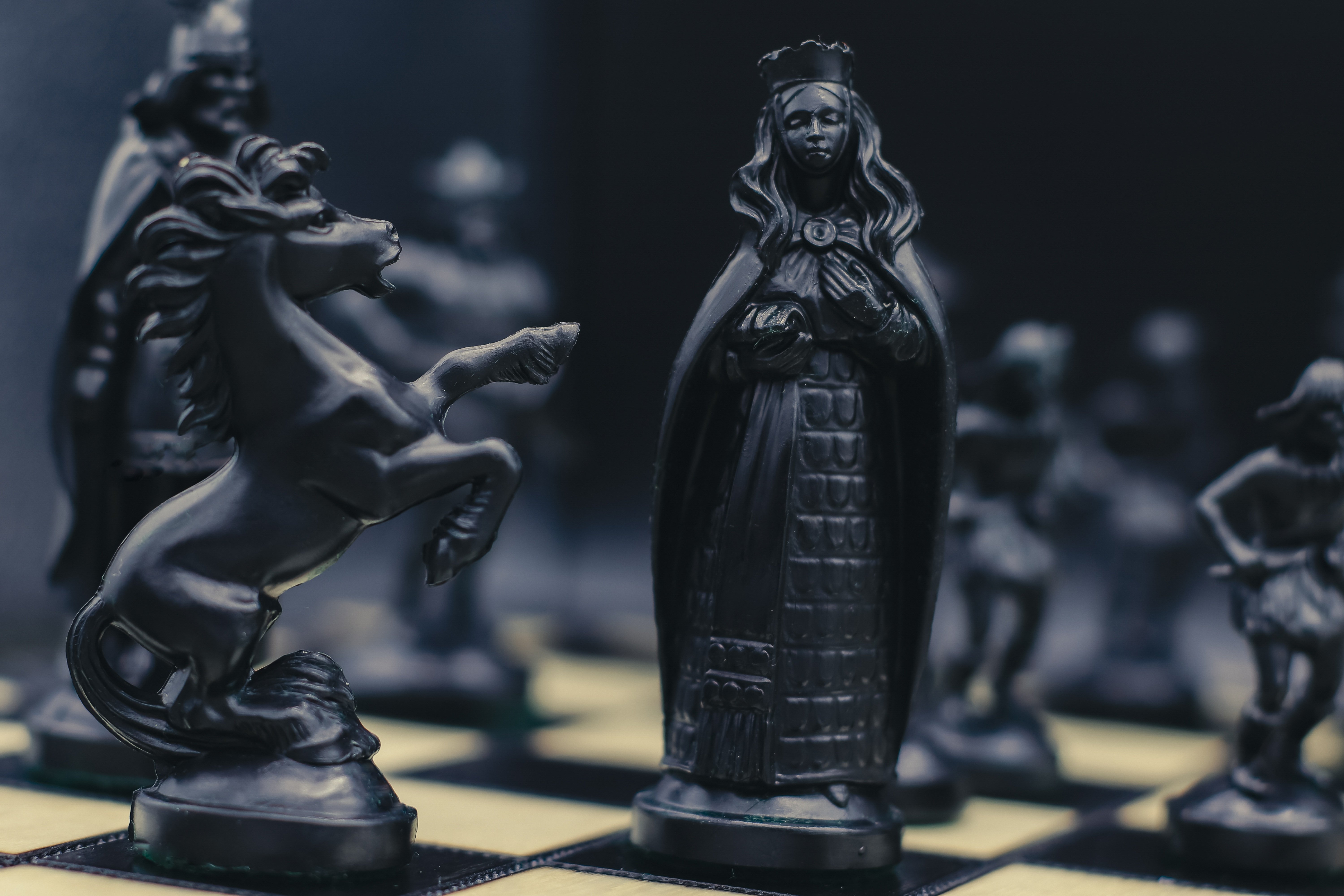 A chess board mid-game, a nod to strategic decisions